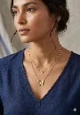 elegant gold layered necklace with butterfly and floral pendant.webp