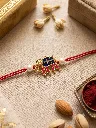 Royal Blue & Pink Meenakari Elephant Rakhi with Pearl Accents.webp