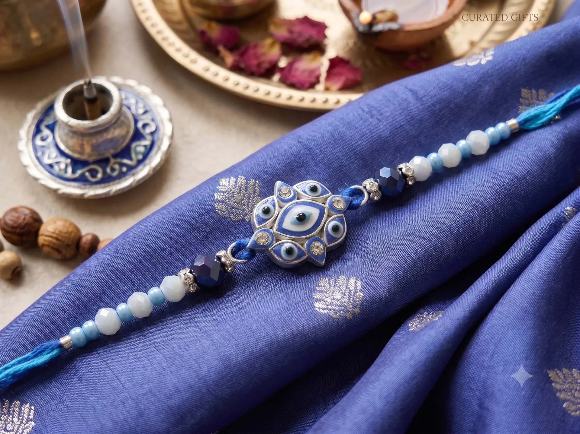 Silver Plated Floral Evil Eye Designer Rakhi for Brother – Blue Crystal Beaded Rakhi Thread