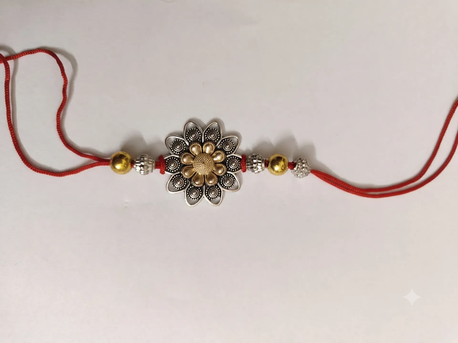 Oxidized Silver & Gold Dual-Tone Floral Rakhi