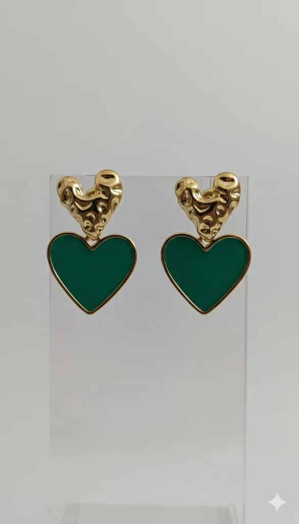 Elegant gold-tone earrings featuring sculpted heart tops paired with glossy emerald-green heart drops